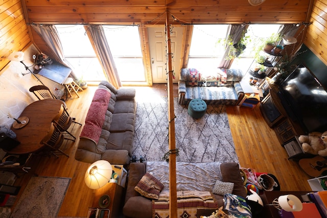 interior space featuring wood finished floors and wooden walls
