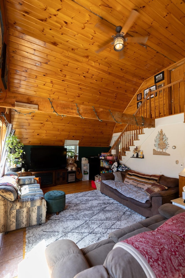 living area featuring wood ceiling, a ceiling fan, stairs, and high vaulted ceiling
