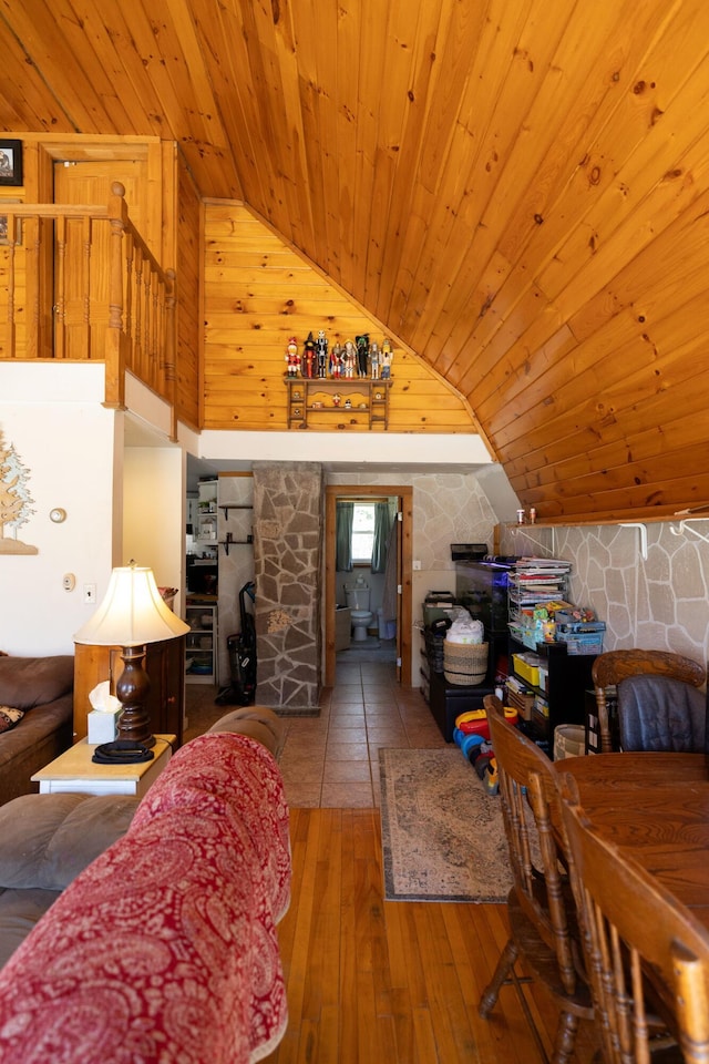 interior space featuring wood ceiling, hardwood / wood-style floors, and high vaulted ceiling