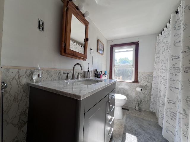 113 River Rd, Dresden, ME 04342 - bathroom featuring tile walls, vanity, wainscoting, tile patterned floors, and a shower with shower curtain