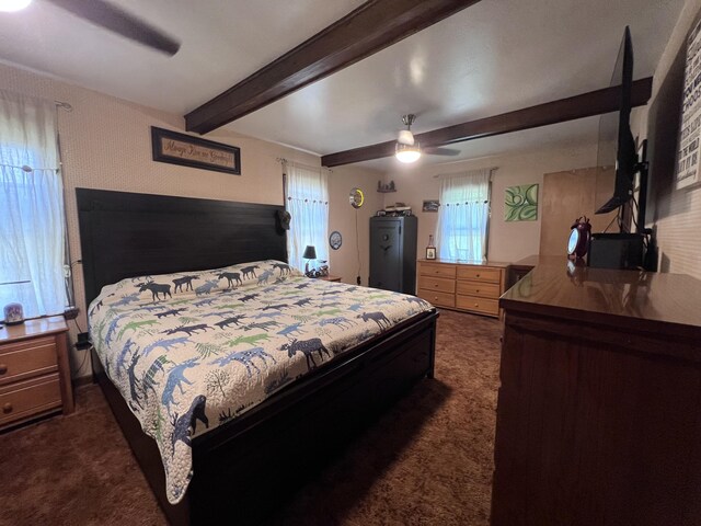 113 River Rd, Dresden, ME 04342 - bedroom featuring dark carpet, beamed ceiling, and ceiling fan