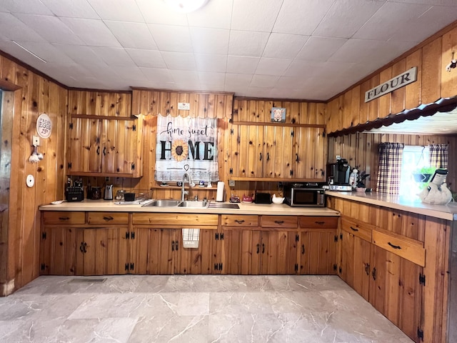 113 River Rd, Dresden, ME 04342 - kitchen with brown cabinets, light countertops, and wood walls
