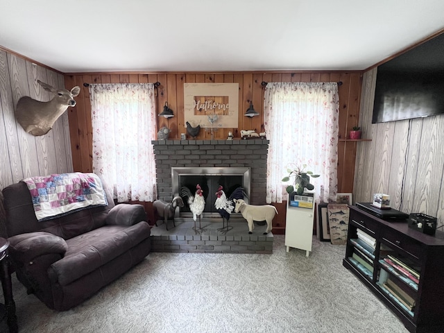113 River Rd, Dresden, ME 04342 - living area featuring wood walls, carpet, healthy amount of natural light, and a brick fireplace