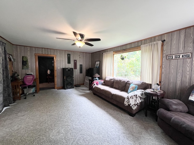 113 River Rd, Dresden, ME 04342 - living area featuring carpet flooring, a ceiling fan, electric panel, and wood walls