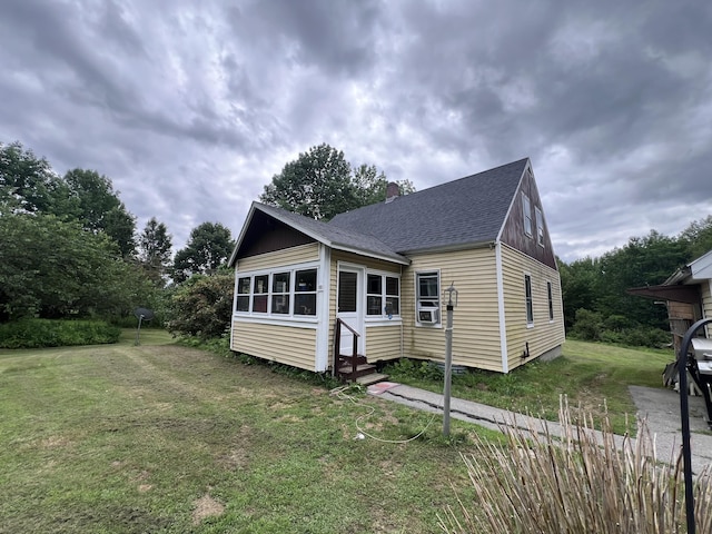 113 River Rd, Dresden, ME 04342 - view of front of property with entry steps, a front yard, a shingled roof, and a chimney