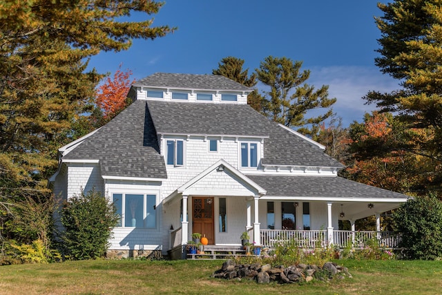 26 Old Searsport Ave, Belfast, ME 04915 - view of front facade featuring a porch, roof with shingles, and a front yard