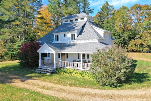 26 Old Searsport Ave, Belfast, ME 04915 - view of front facade with a porch, a shingled roof, and a front lawn