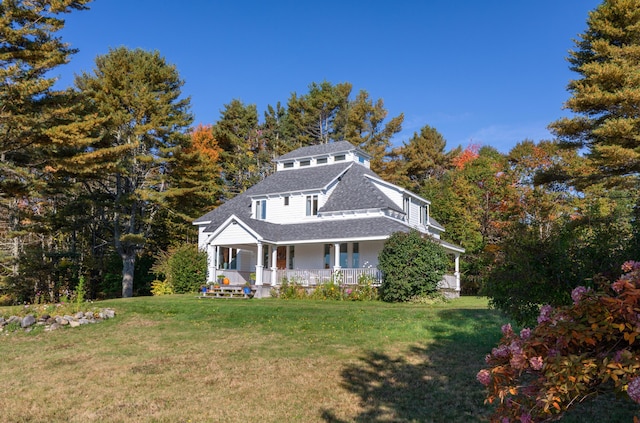 26 Old Searsport Ave, Belfast, ME 04915 - view of front of property featuring roof with shingles, a porch, and a front lawn