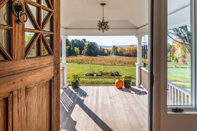 26 Old Searsport Ave, Belfast, ME 04915 - doorway featuring a wealth of natural light, a raised ceiling, and wood finished floors