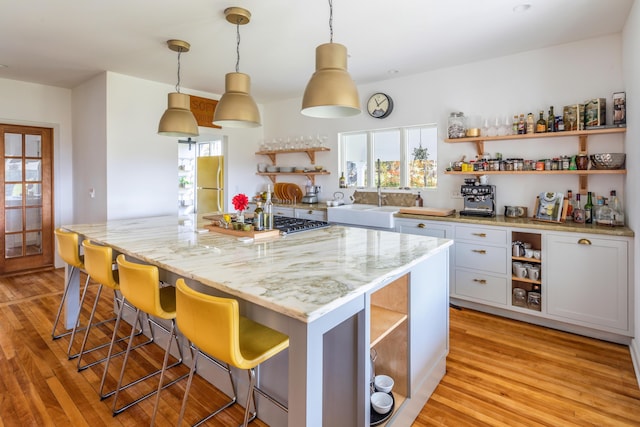 26 Old Searsport Ave, Belfast, ME 04915 - kitchen featuring plenty of natural light, open shelves, and stainless steel appliances