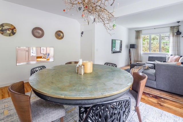 26 Old Searsport Ave, Belfast, ME 04915 - dining space with wood finished floors and a notable chandelier