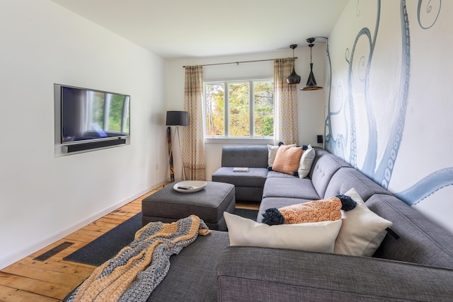 26 Old Searsport Ave, Belfast, ME 04915 - living area with visible vents, baseboards, and hardwood / wood-style flooring