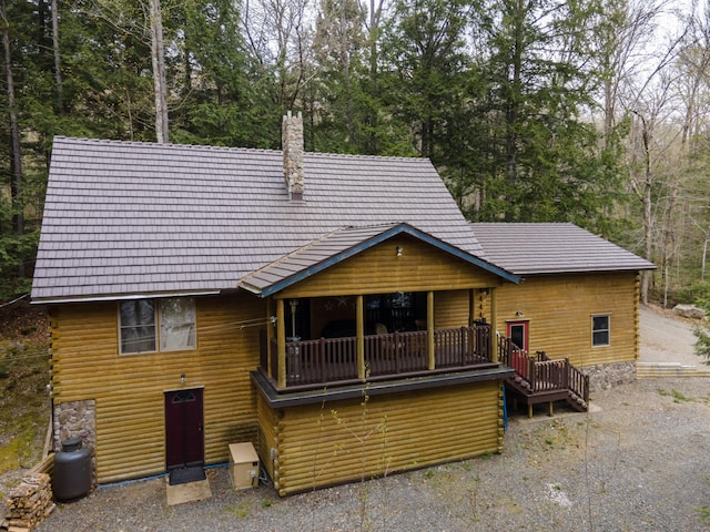 5 Canoe Ct Unit T3 R9, Nwp, ME 04462 - back of property featuring a chimney and log exterior