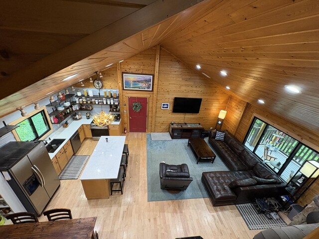 5 Canoe Ct Unit T3 R9, Nwp, ME 04462 - living area featuring wood walls, vaulted ceiling, light wood finished floors, recessed lighting, and wooden ceiling