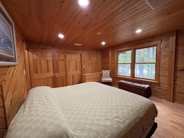 5 Canoe Ct Unit T3 R9, Nwp, ME 04462 - bedroom featuring wood walls, wood ceiling, light wood-style flooring, recessed lighting, and a closet