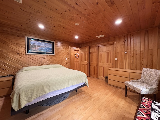 5 Canoe Ct Unit T3 R9, Nwp, ME 04462 - bedroom with wooden walls, wooden ceiling, light wood-style floors, recessed lighting, and a closet