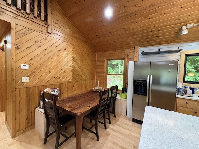 5 Canoe Ct Unit T3 R9, Nwp, ME 04462 - dining room with lofted ceiling, wood walls, light wood-style floors, and wood ceiling