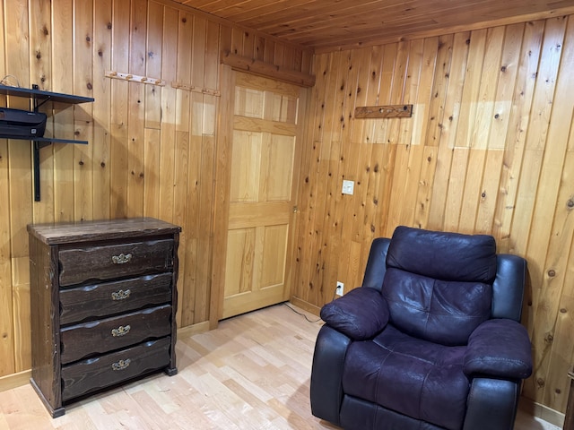 5 Canoe Ct Unit T3 R9, Nwp, ME 04462 - sitting room featuring wooden walls, wood ceiling, and wood finished floors