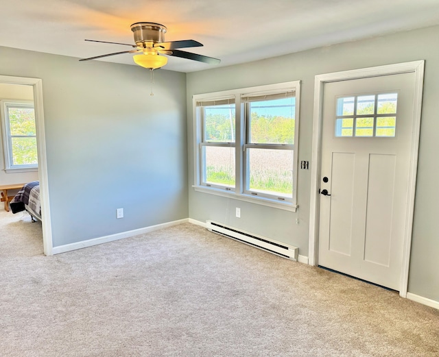 18 Hampton Ave, Old Orchard Beach, ME 04064 - entryway featuring a baseboard heating unit, carpet, plenty of natural light, and a ceiling fan