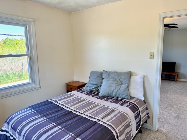 18 Hampton Ave, Old Orchard Beach, ME 04064 - carpeted bedroom with multiple windows and baseboards