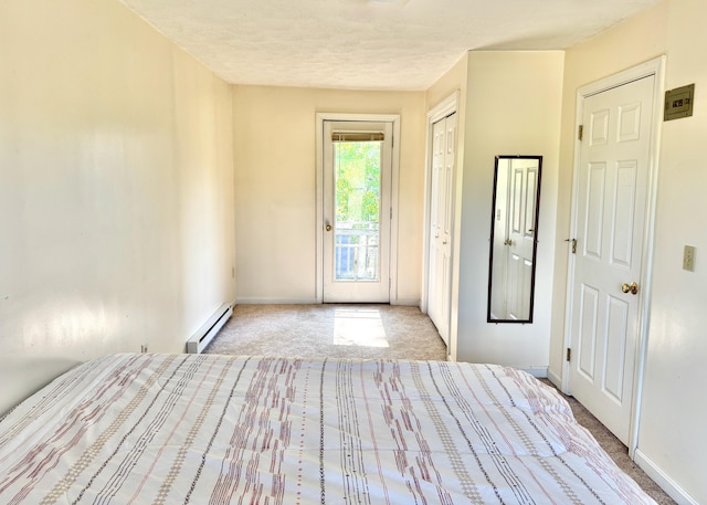 18 Hampton Ave, Old Orchard Beach, ME 04064 - unfurnished bedroom with a baseboard radiator, access to exterior, carpet flooring, baseboards, and a textured ceiling