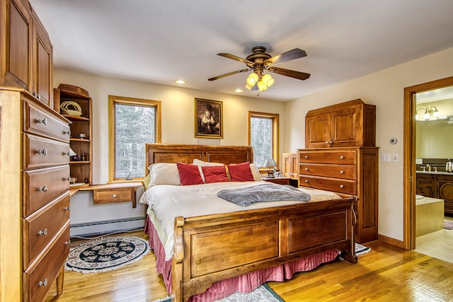 bedroom with light wood-type flooring, recessed lighting, baseboard heating, and multiple windows