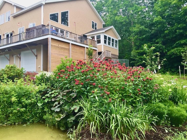 back of property featuring a garage