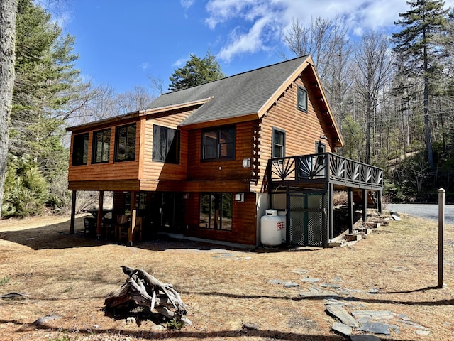 106 N Birch St, Greenville, ME 04441 - view of property exterior with a deck, roof with shingles, and log siding