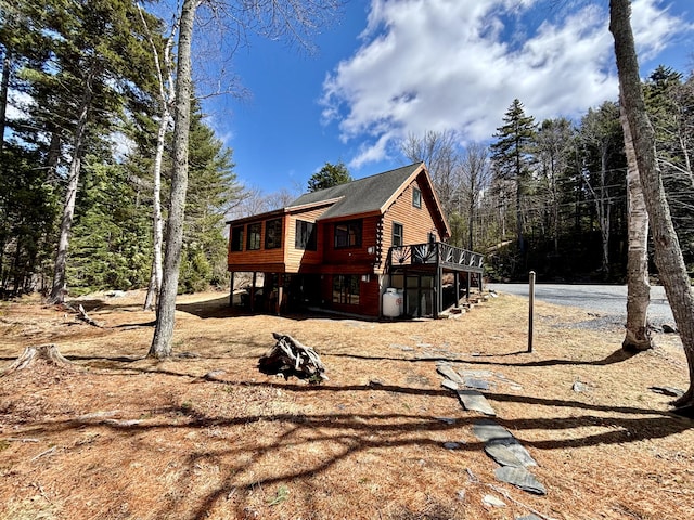 106 N Birch St, Greenville, ME 04441 - view of home's exterior with a wooden deck and a shingled roof