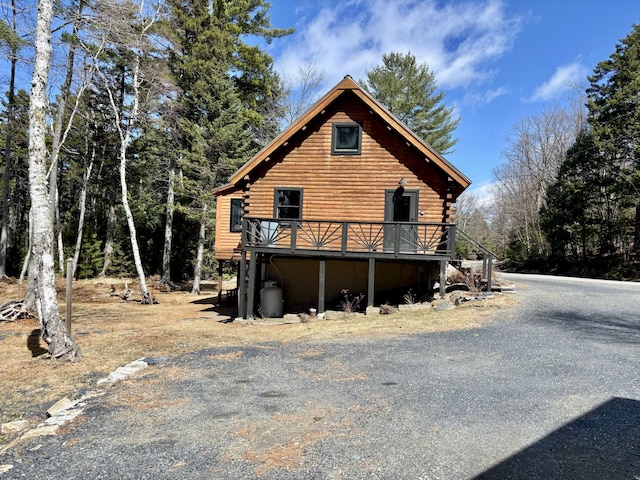 106 N Birch St, Greenville, ME 04441 - view of home's exterior featuring log exterior and a wooden deck