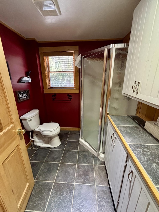 106 N Birch St, Greenville, ME 04441 - full bathroom with toilet, a stall shower, tile patterned floors, and vanity