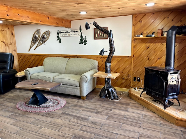 106 N Birch St, Greenville, ME 04441 - living room with wood walls, recessed lighting, wood finished floors, a wainscoted wall, and a wood stove