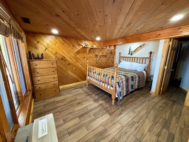 106 N Birch St, Greenville, ME 04441 - bedroom with wood finished floors, wooden walls, wooden ceiling, baseboards, and recessed lighting
