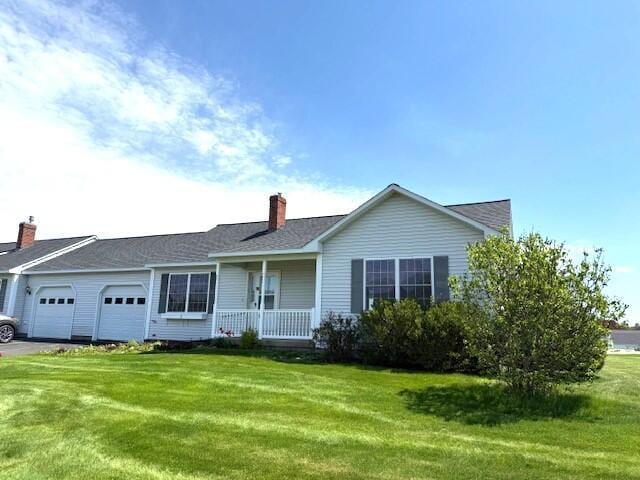 10 Private Dr Unit 10, Winslow, ME 04901 - ranch-style home featuring covered porch, a garage, a chimney, and a front lawn