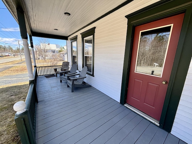 wooden terrace with a porch