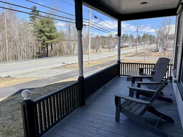 wooden terrace featuring covered porch