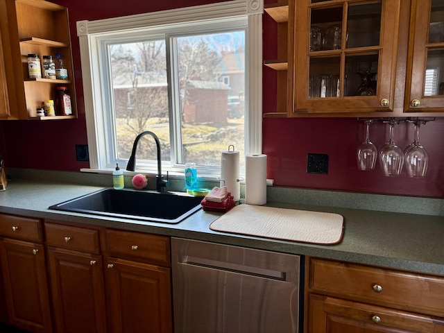 kitchen featuring brown cabinetry, open shelves, and a sink