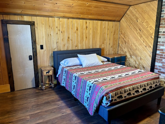 bedroom with wood ceiling, wooden walls, wood finished floors, and vaulted ceiling