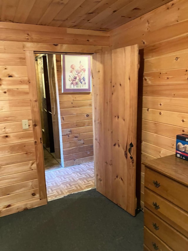 hall with wooden walls and wood ceiling