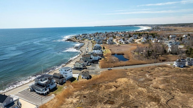 bird's eye view featuring a view of the beach and a water view