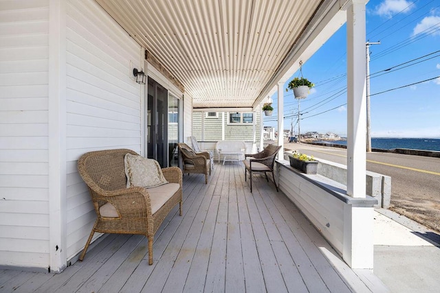 wooden terrace with a porch
