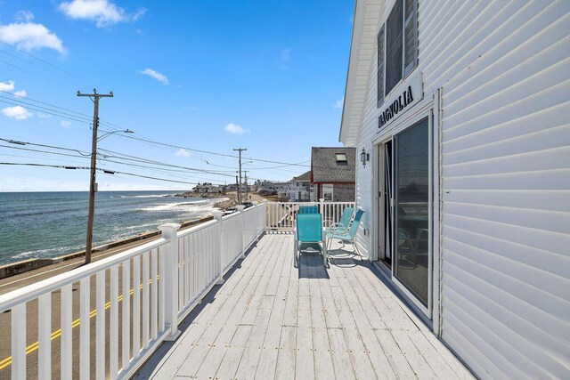 wooden deck with a water view