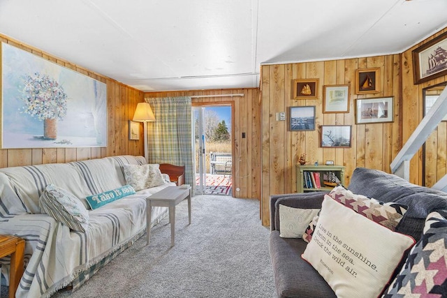 living room with wood walls and carpet flooring