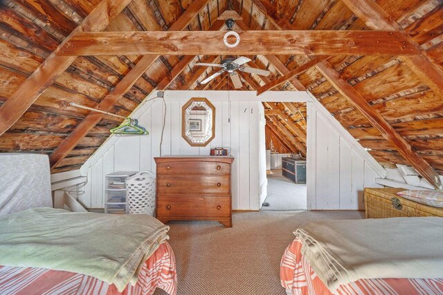 bedroom with vaulted ceiling with beams, wooden ceiling, and carpet flooring