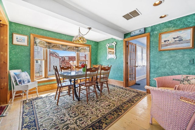 dining area with wallpapered walls, visible vents, french doors, wood-type flooring, and baseboards