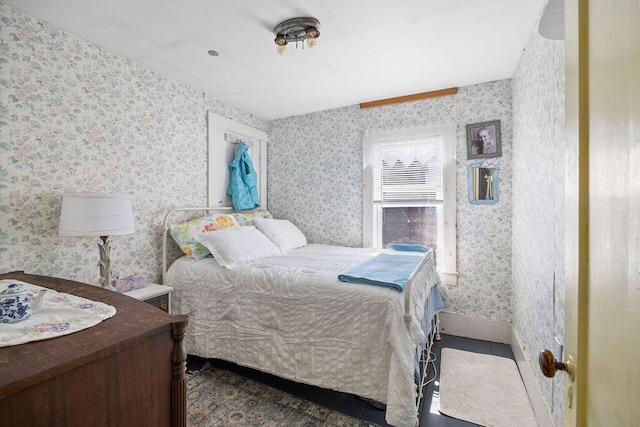 bedroom with wallpapered walls