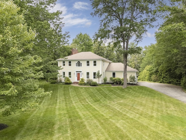 9 Hemlock Dr, Cumberland, ME 04021 - colonial inspired home with a chimney and a front yard