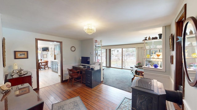 living room featuring a chandelier and wood finished floors