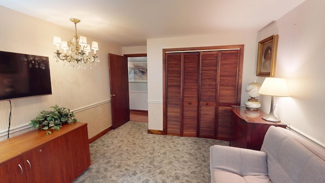 interior space featuring a notable chandelier and carpet floors
