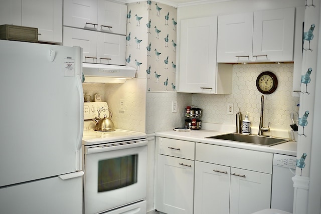 kitchen featuring white cabinets, a sink, white appliances, under cabinet range hood, and backsplash